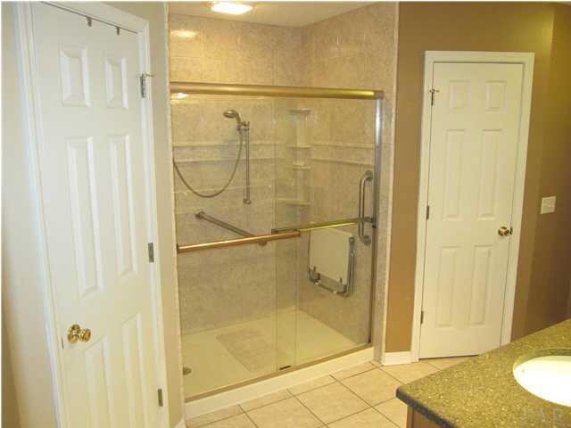 5987 Ridge Crest Court Milton, FL 32570 - Photo 11 of 24 Remodeled shower & his & her walk-in closets on each side.