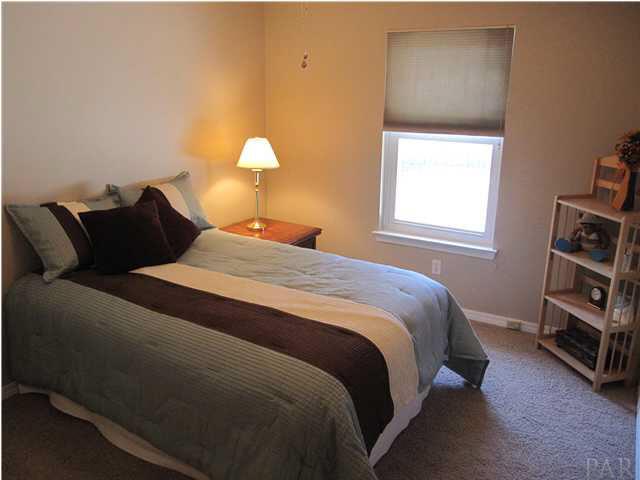 5987 Ridge Crest Court Milton, FL 32570 - Photo 12 of 24 Additional bedroom at the back of home.