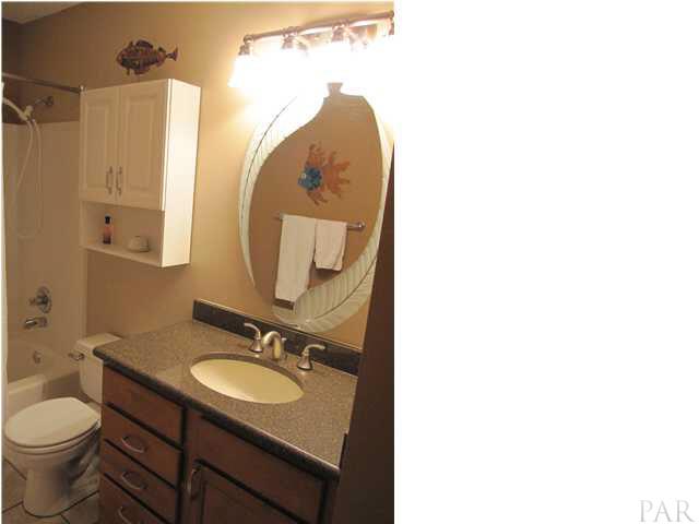 5987 Ridge Crest Court Milton, FL 32570 - Photo 13 of 24 Full bath in hall by additional bedrooms.Maple cabinets with Granite countertops.