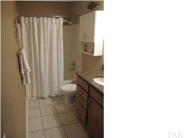 5987 Ridge Crest Court Milton, FL 32570 - Photo 14 of 24 Full bath view from hallway.