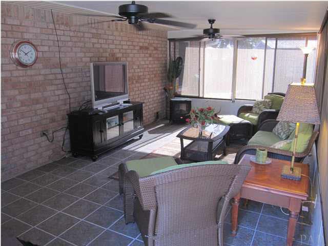 5987 Ridge Crest Court Milton, FL 32570 - Photo 17 of 24 Florida room view from door to pool. Entrance to familiy room to the left.