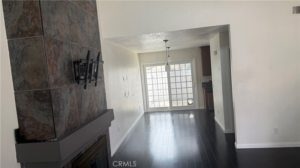 12309 Wintergreen Street Rancho Cucamonga, CA 91739 - Photo 9 of 32 Living-room with slate stone fireplace, looking towards dining and kitchen