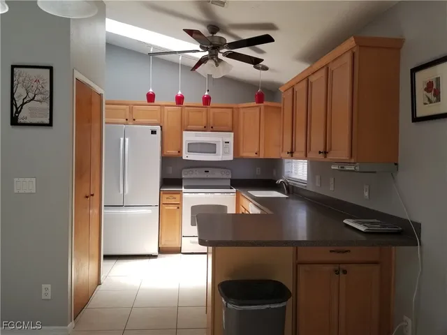 a view of a livingroom with a chair and wooden floor