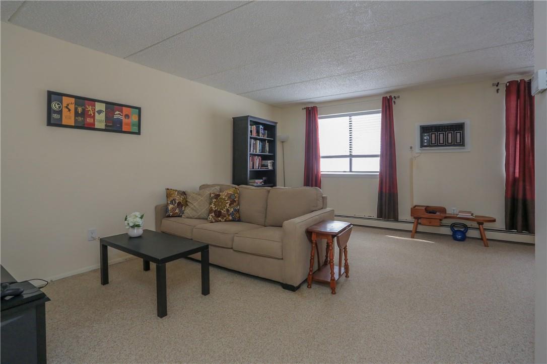 124 North Rte 303, Unit 7 Congers, NY 10920 - Photo 1 of 1 a living room with furniture and a window