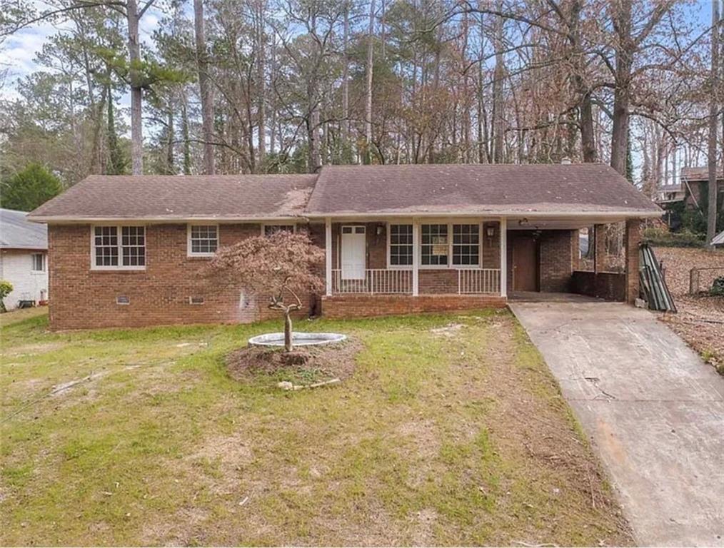4334 Greenleaf Circle Southwest Atlanta, GA 30331 - Photo 1 of 12 a front view of a house with a garden