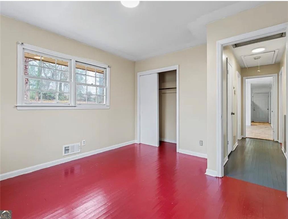 4334 Greenleaf Circle Southwest Atlanta, GA 30331 - Photo 7 of 12 an empty room with wooden floor and windows