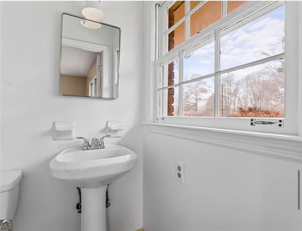 4334 Greenleaf Circle Southwest Atlanta, GA 30331 - Photo 9 of 12 a bathroom with a sink and a mirror