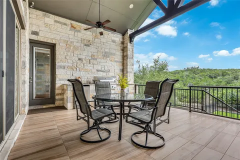 a view of a patio with table and chairs