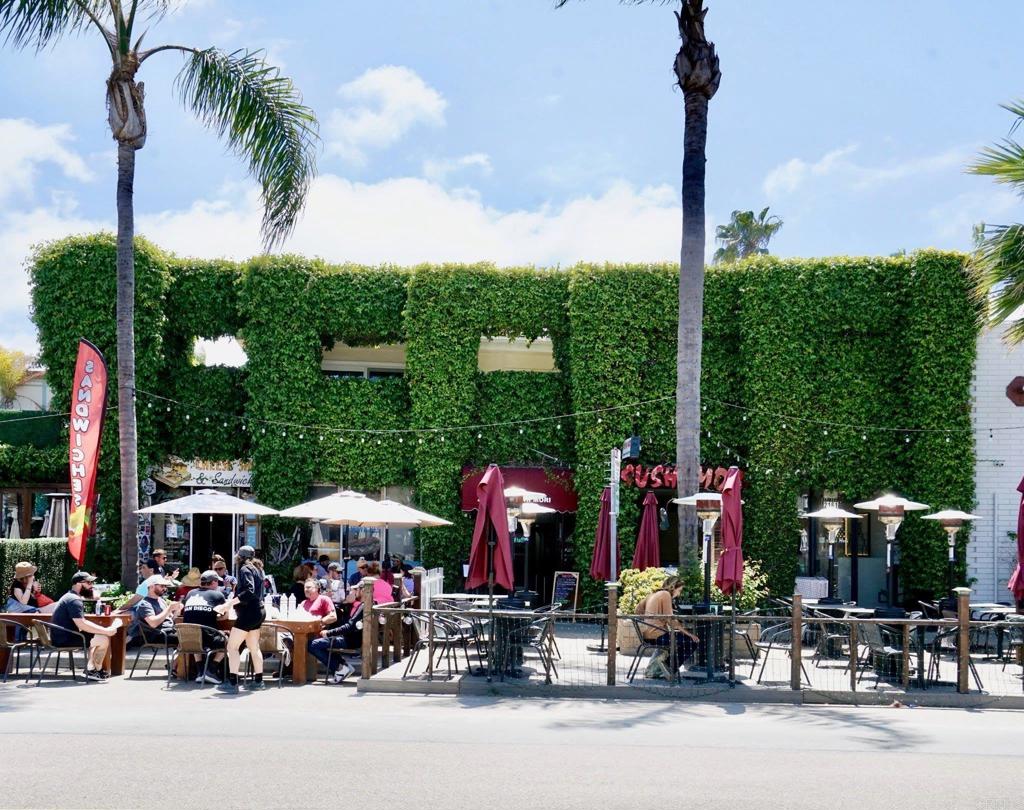 2159-65 Avenida De La Playa La Jolla, CA 92037 - Photo 1 of 42 a group of people sitting in front of a fountain