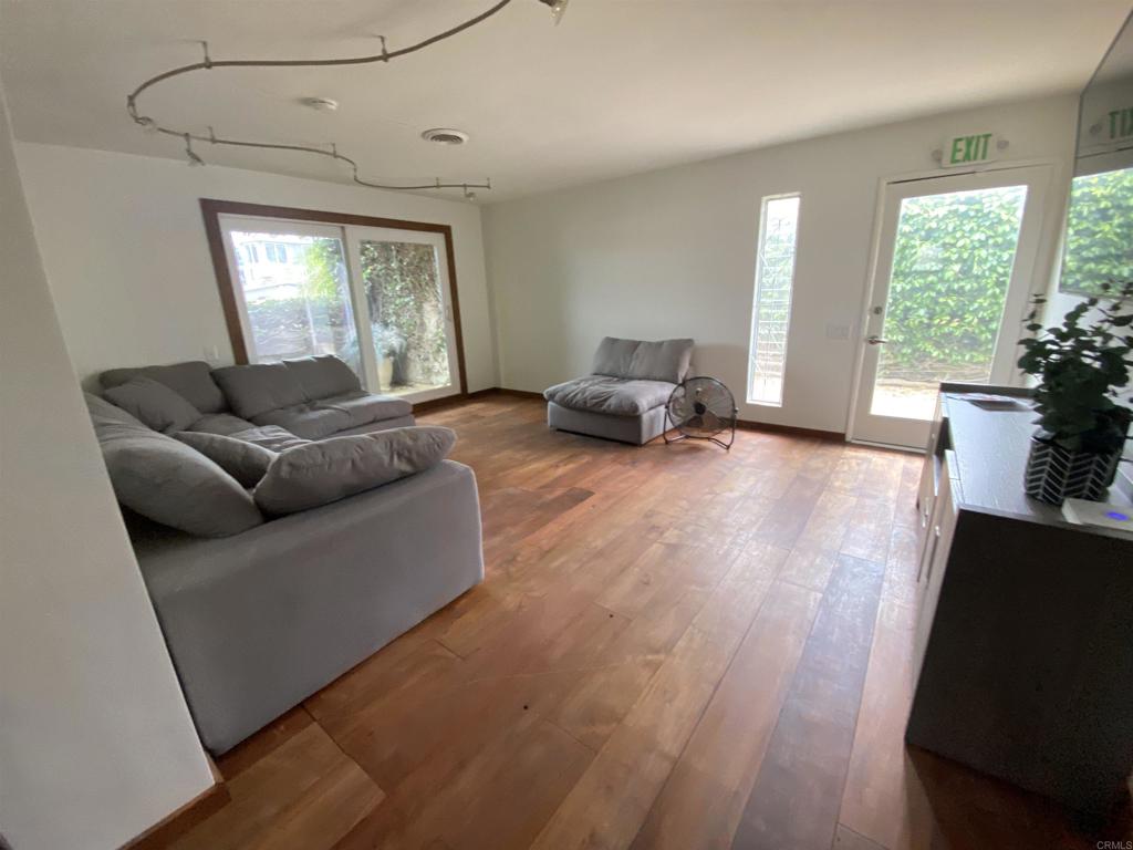 2159-65 Avenida De La Playa La Jolla, CA 92037 - Photo 20 of 42 a living room with furniture and a wooden floor
