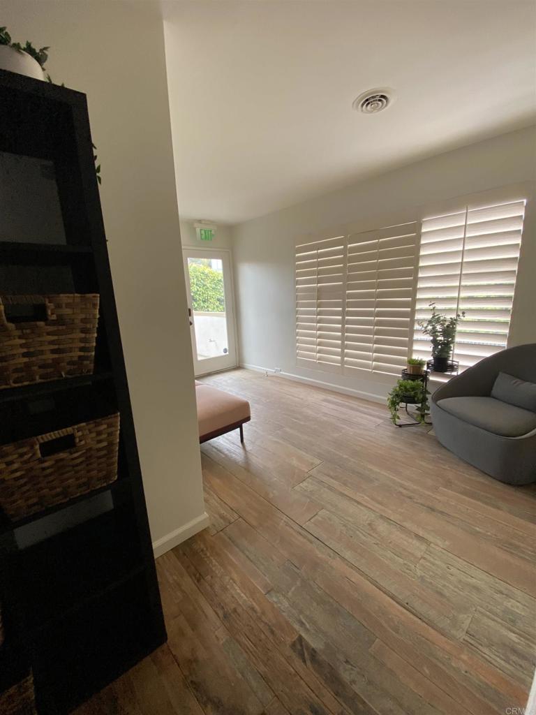 2159-65 Avenida De La Playa La Jolla, CA 92037 - Photo 26 of 42 a living room with furniture and a flat screen tv
