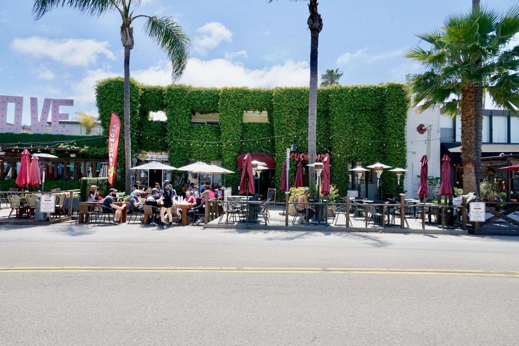 2159-65 Avenida De La Playa La Jolla, CA 92037 - Photo 3 of 42 a view of street with a parked cars and palm tree