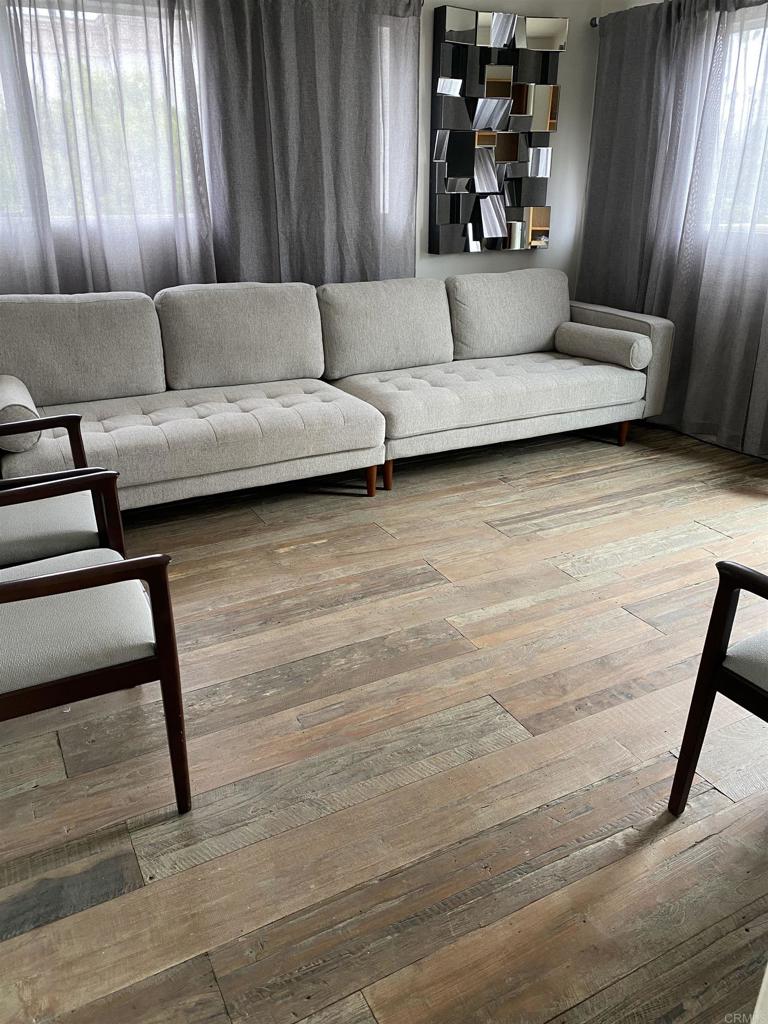 2159-65 Avenida De La Playa La Jolla, CA 92037 - Photo 32 of 42 a living room with furniture and wooden floor