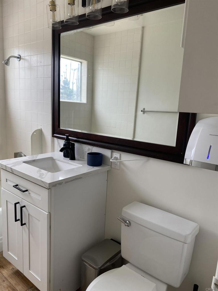 2159-65 Avenida De La Playa La Jolla, CA 92037 - Photo 33 of 42 a bathroom with a sink and a toilet