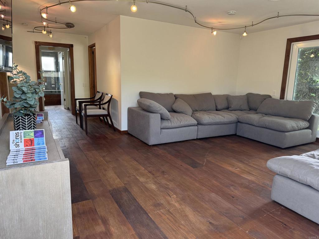 2159-65 Avenida De La Playa La Jolla, CA 92037 - Photo 37 of 42 a living room with furniture and a wooden floor