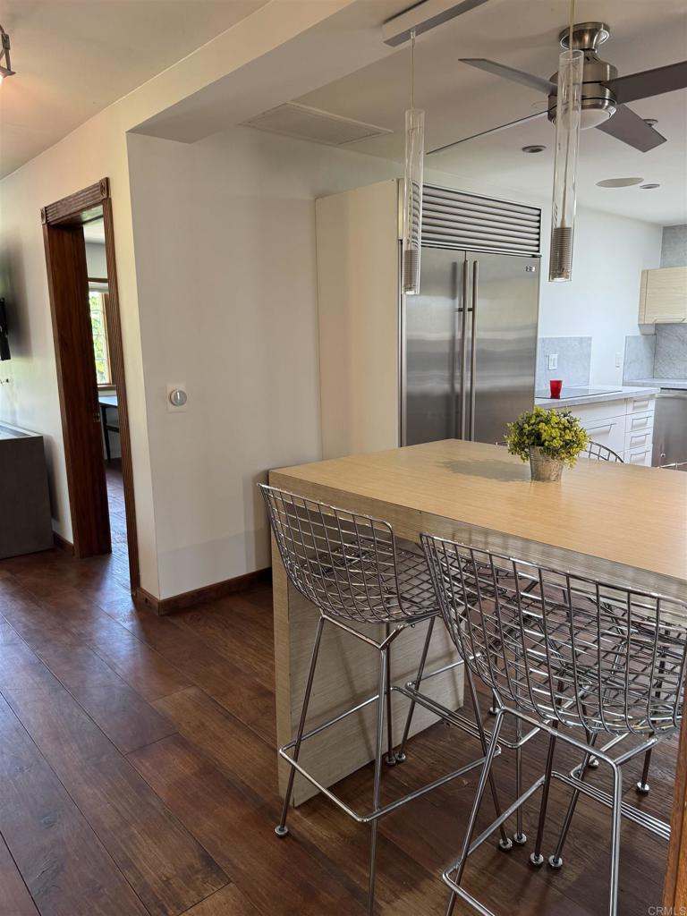 2159-65 Avenida De La Playa La Jolla, CA 92037 - Photo 39 of 42 a room with wooden floors and glass door