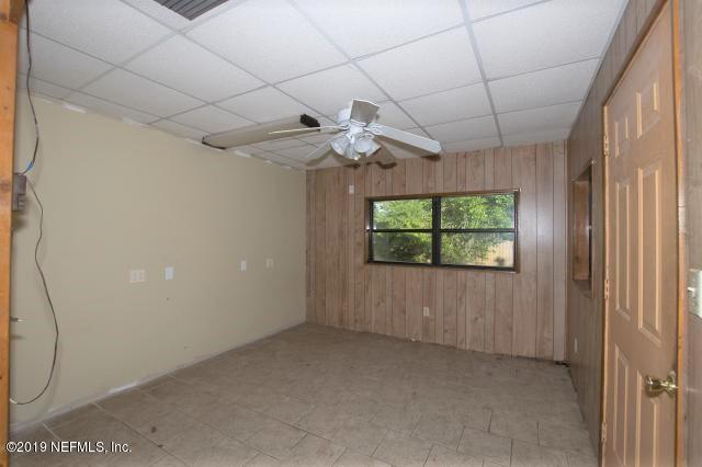 183 Shores Boulevard St. Augustine, FL 32086 - Photo 17 of 22 a view of an empty room with a window