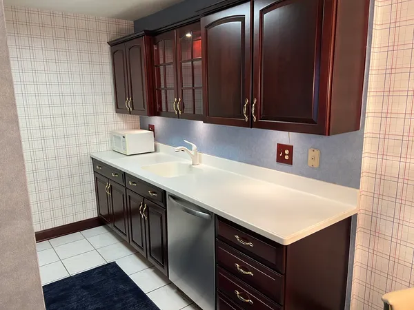 a kitchen with a sink and cabinets