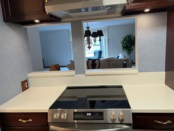 a kitchen with a stove and a microwave