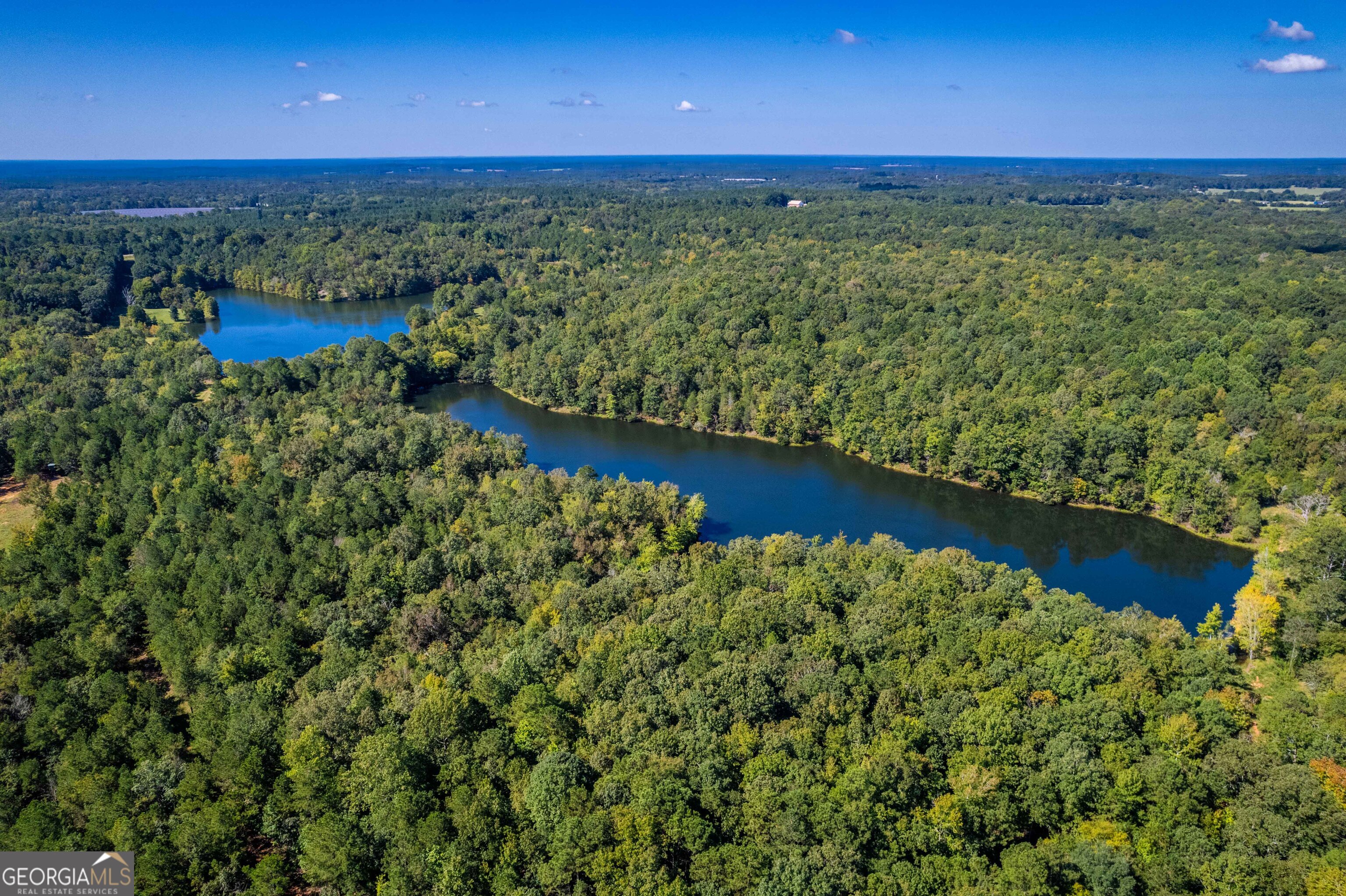 2688 Calhoun Falls Highway Elberton, GA 30635 - Photo 20 of 55 a view of a lake with a yard
