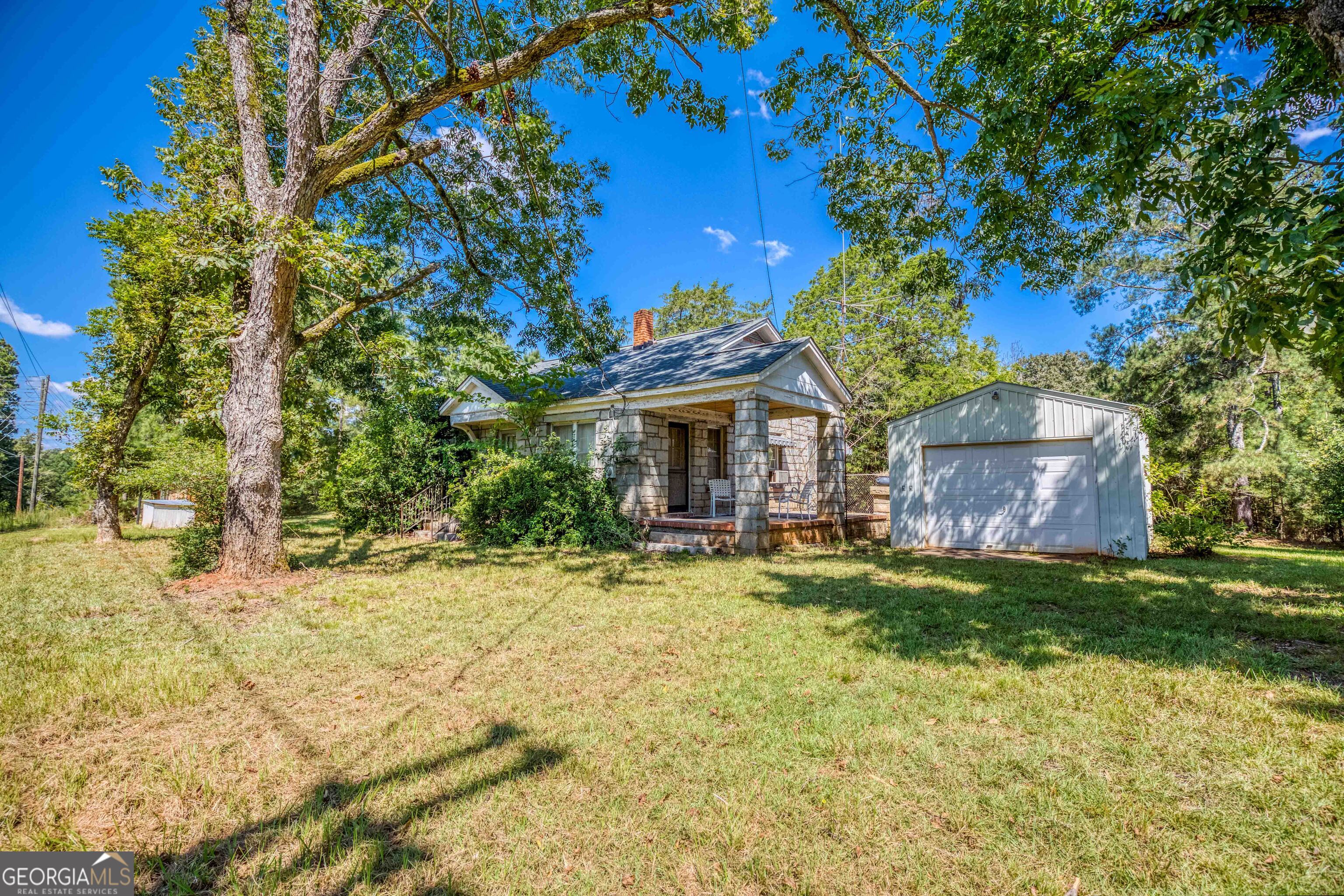 2688 Calhoun Falls Highway Elberton, GA 30635 - Photo 49 of 55 a front view of a house with a garden