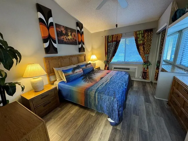 a bed room with two beds and a night stand