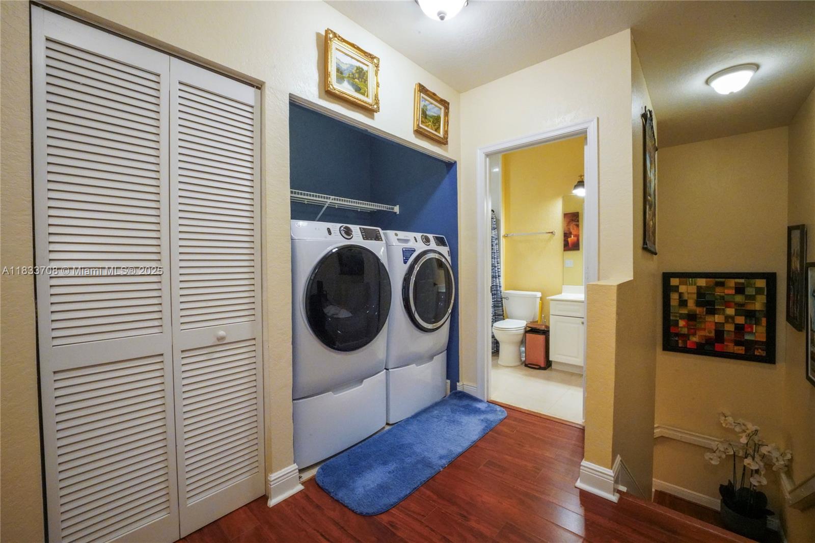 3335 Palomino Drive Davie, FL 33024 - Photo 17 of 31 a view of a bedroom with washer and dryer