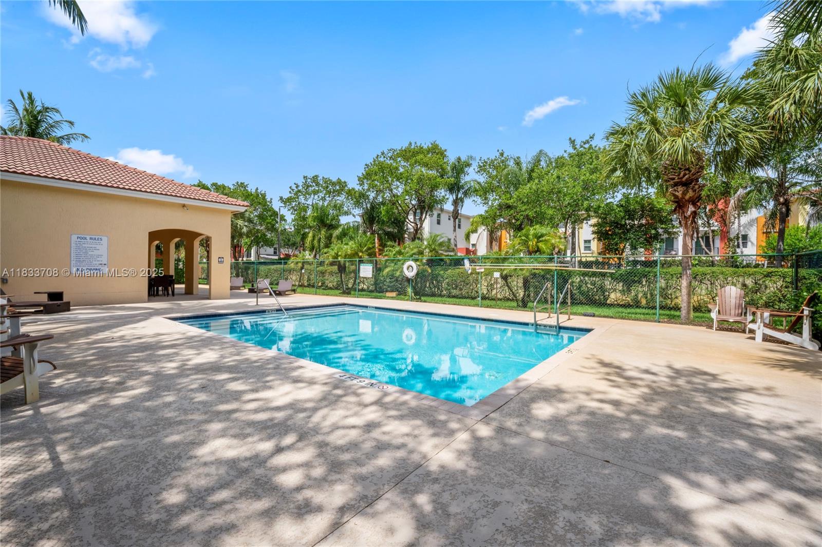 3335 Palomino Drive Davie, FL 33024 - Photo 24 of 31 a view of a swimming pool with a yard