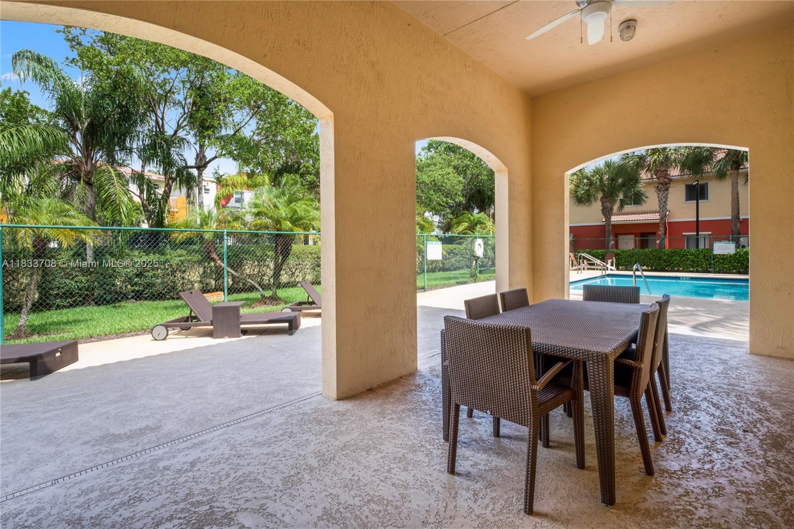3335 Palomino Drive Davie, FL 33024 - Photo 26 of 31 a view of a patio with a table and chairs