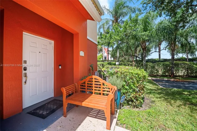 a view of a wooden bench in a backyard