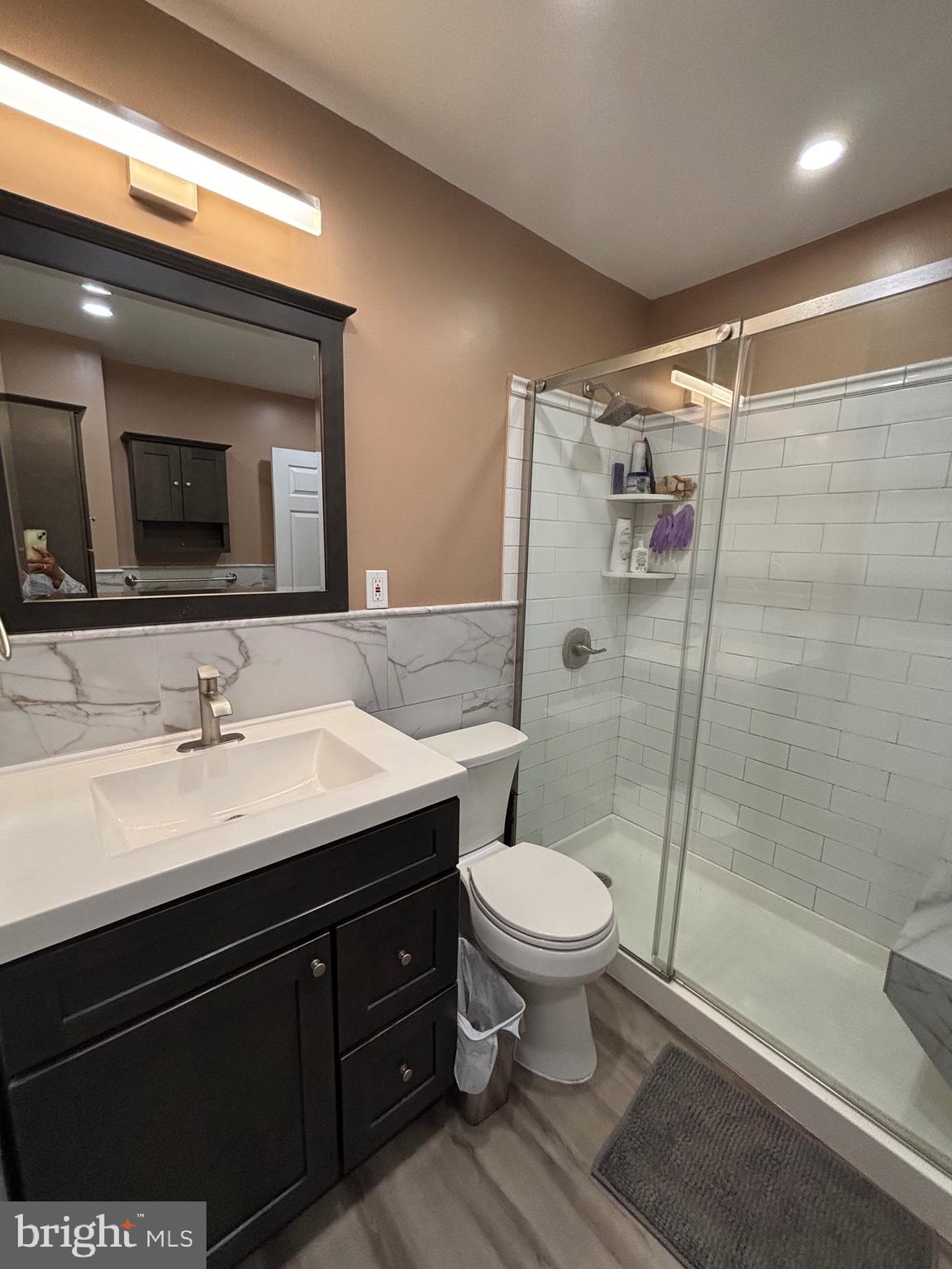 60 High Meadows Drive Sicklerville, NJ 08081 - Photo 40 of 60 a bathroom with a sink a toilet a mirror and shower