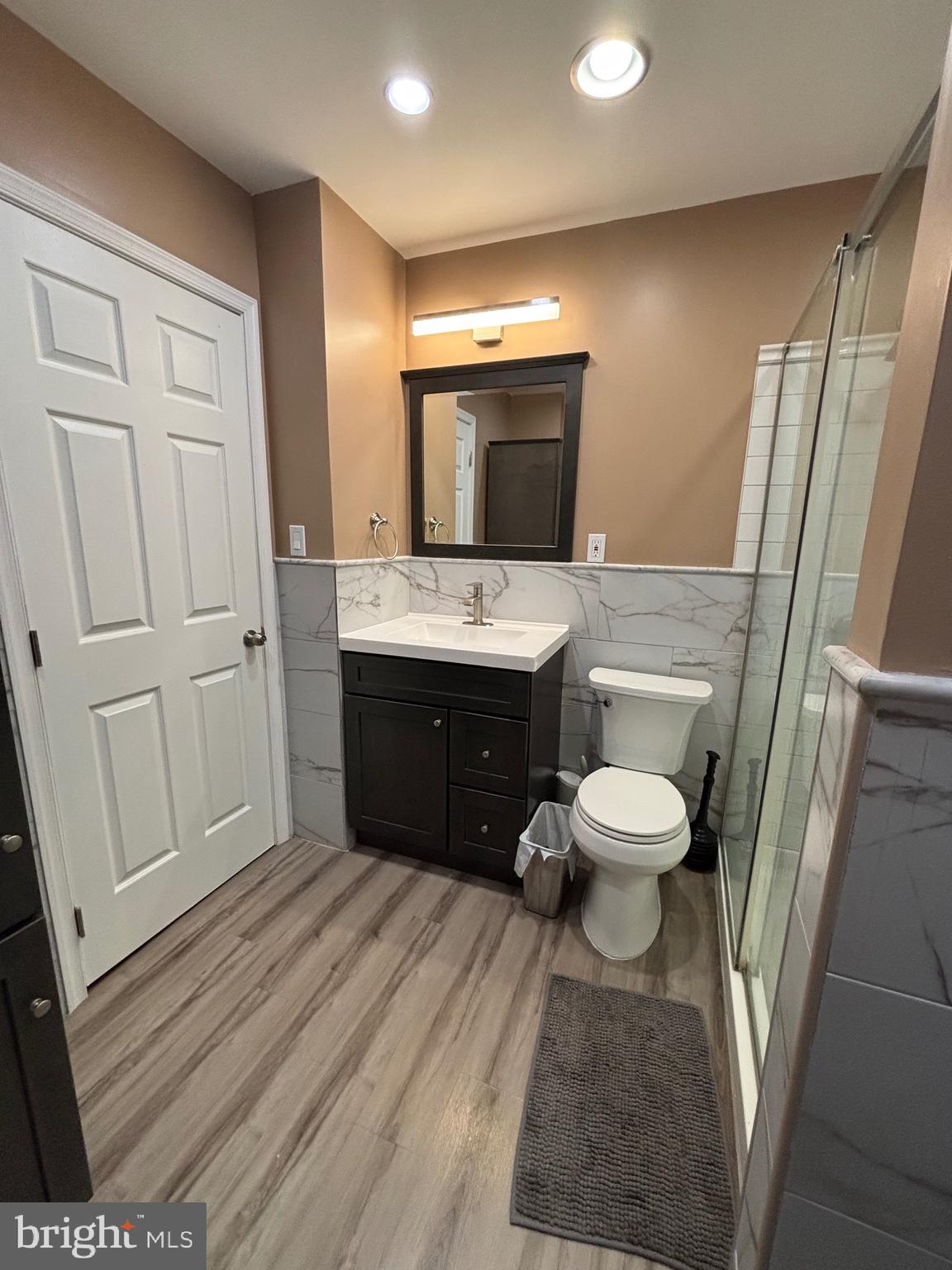 60 High Meadows Drive Sicklerville, NJ 08081 - Photo 41 of 60 a bathroom with a sink a toilet a mirror and vanity