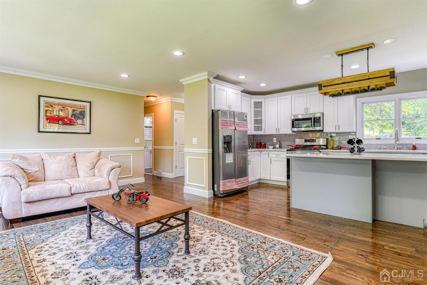 121 Branch Road Bridgewater, NJ 08807 - Photo 5 of 41 a living room with stainless steel appliances kitchen island granite countertop a rug kitchen view and a counter top space