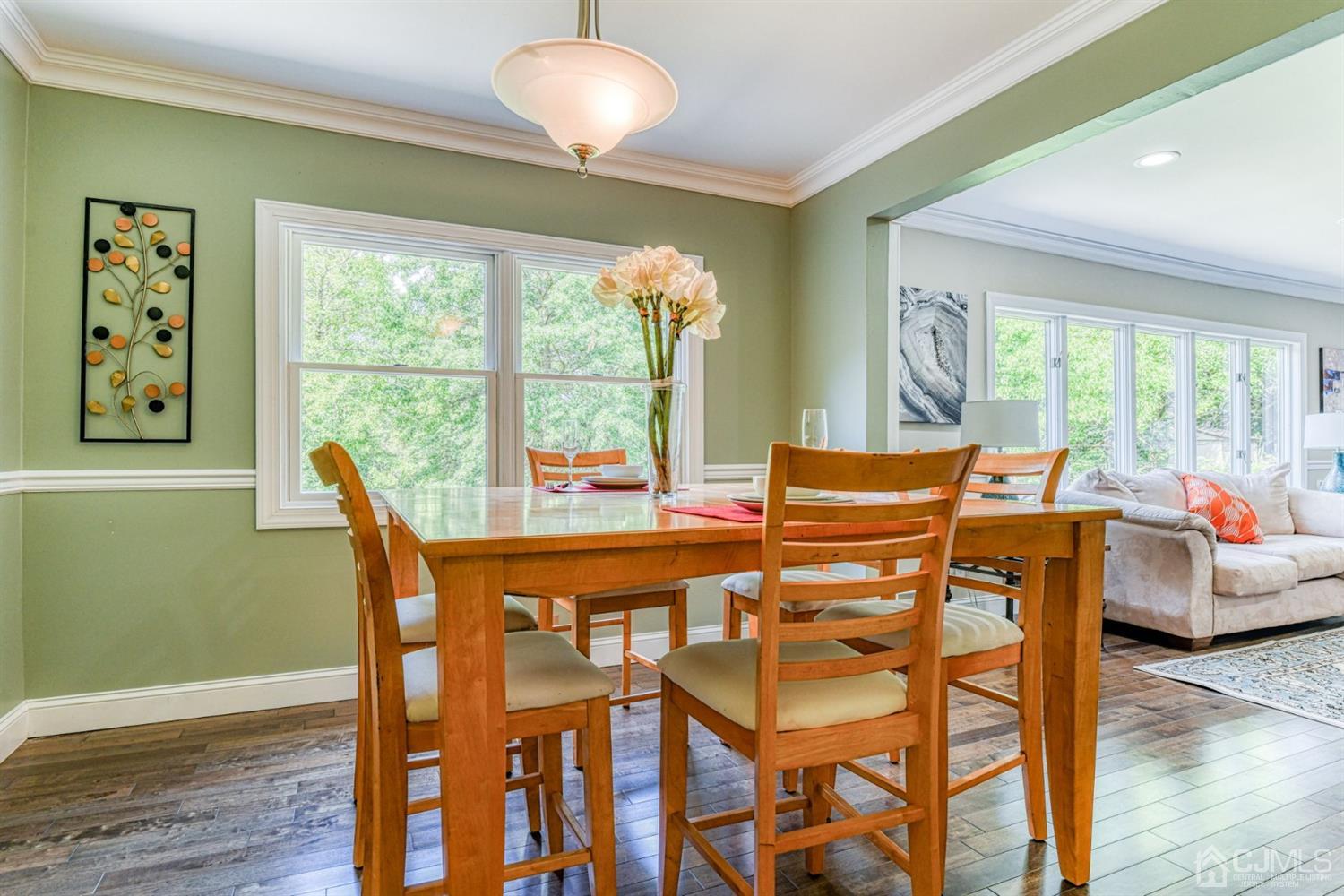 121 Branch Road Bridgewater, NJ 08807 - Photo 8 of 41 a dining room with furniture and wooden floor
