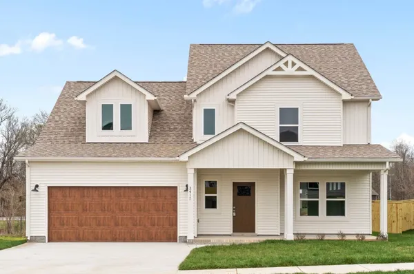 a front view of a house with yard