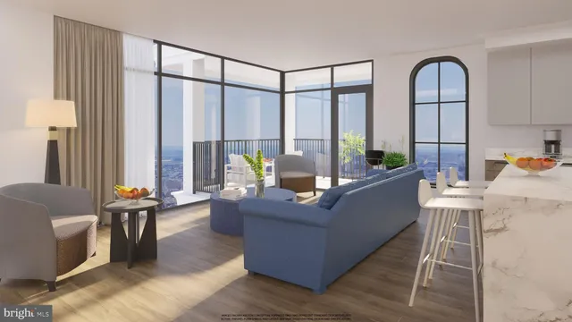 a living room with furniture and large windows