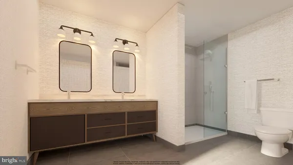 a bathroom with a double vanity sink mirror and toilet