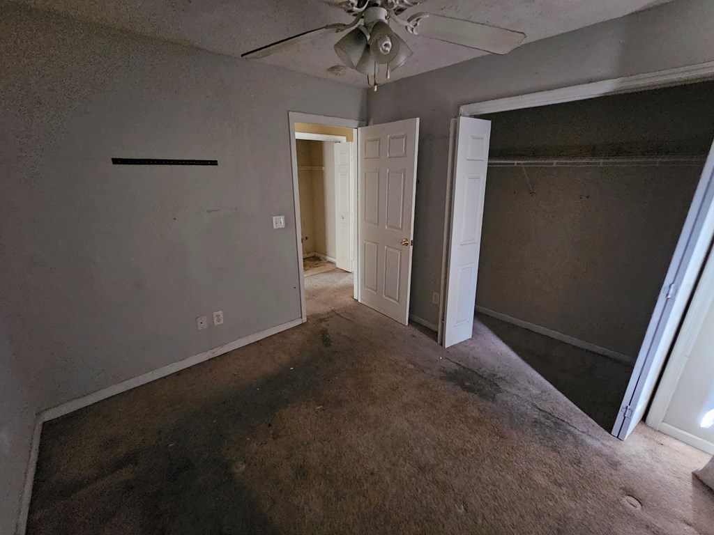 65 Ryan Loop Phenix City, AL 36869 - Photo 11 of 18 en empty room with windows and ceiling fan