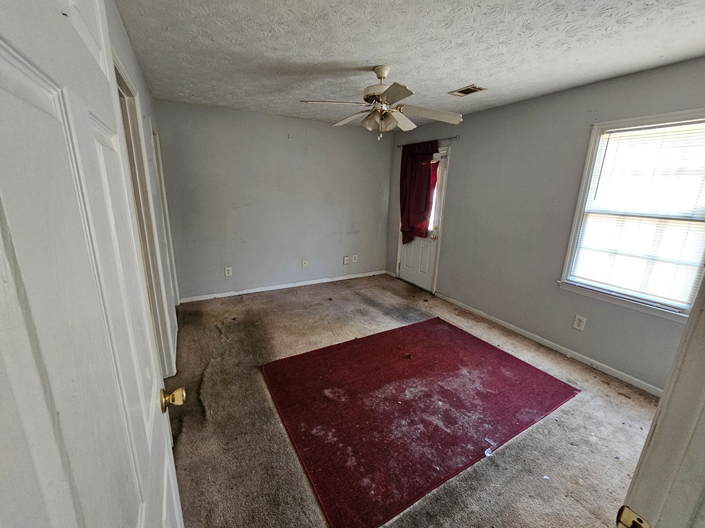 65 Ryan Loop Phenix City, AL 36869 - Photo 12 of 18 wooden floor in a hall with a window