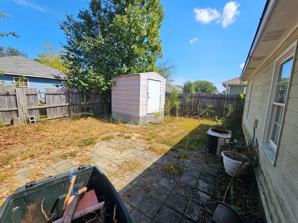 65 Ryan Loop Phenix City, AL 36869 - Photo 16 of 18 a view of roof deck with a barbeque and wooden stairs