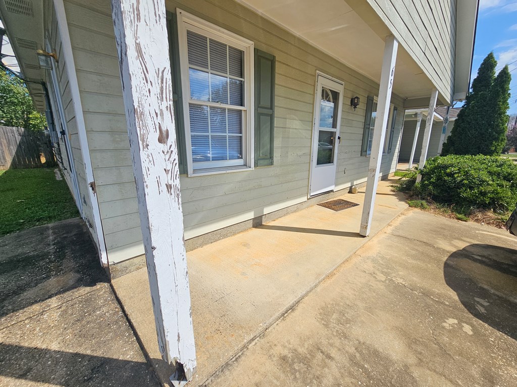 65 Ryan Loop Phenix City, AL 36869 - Photo 2 of 18 a house with trees in front of it