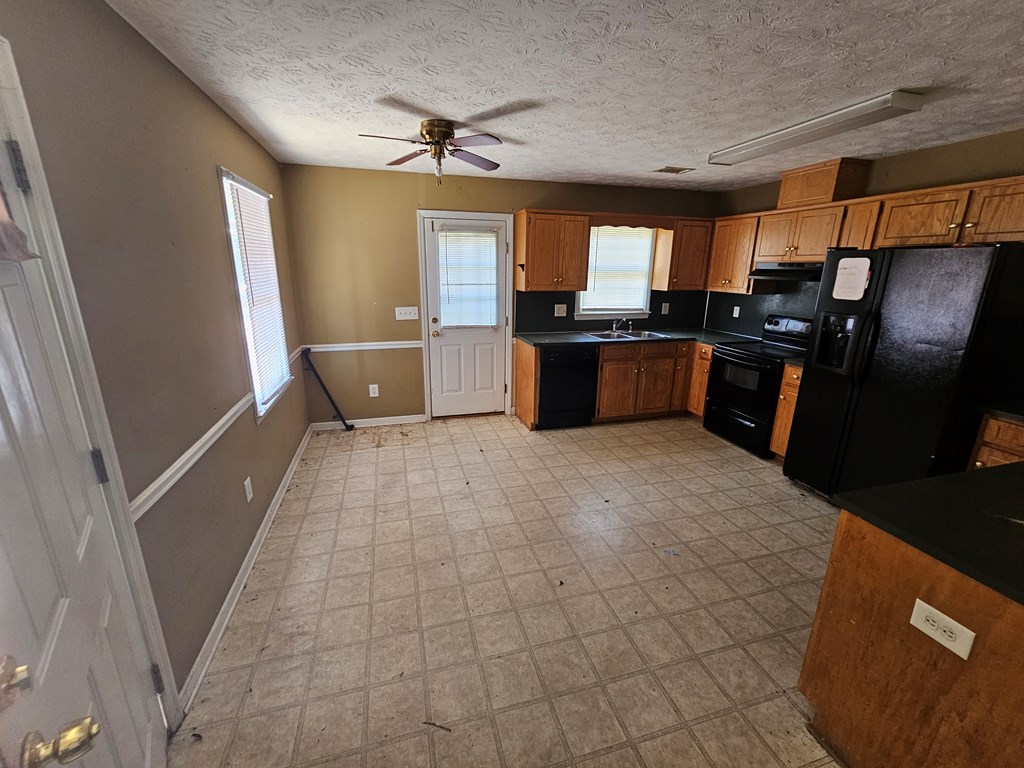 65 Ryan Loop Phenix City, AL 36869 - Photo 6 of 18 a kitchen with stainless steel appliances a refrigerator and microwave