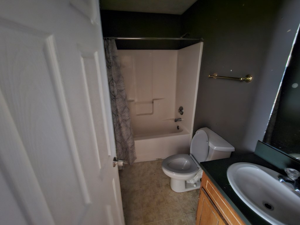 65 Ryan Loop Phenix City, AL 36869 - Photo 9 of 18 a bathroom with a sink and a mirror