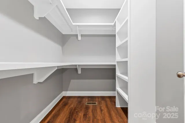 a view of an empty walk in closet