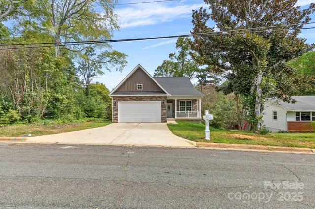 a house with a yard and a large parking space