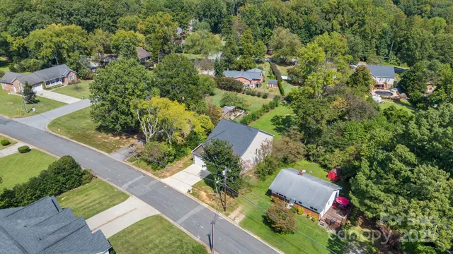 an aerial view of house with yard