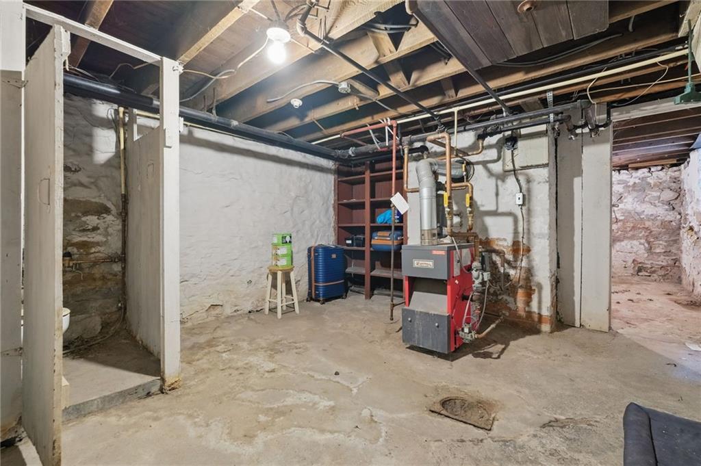 853 Railroad Street McKees Rocks, PA 15136 - Photo 15 of 19 a view of a storage room with furniture