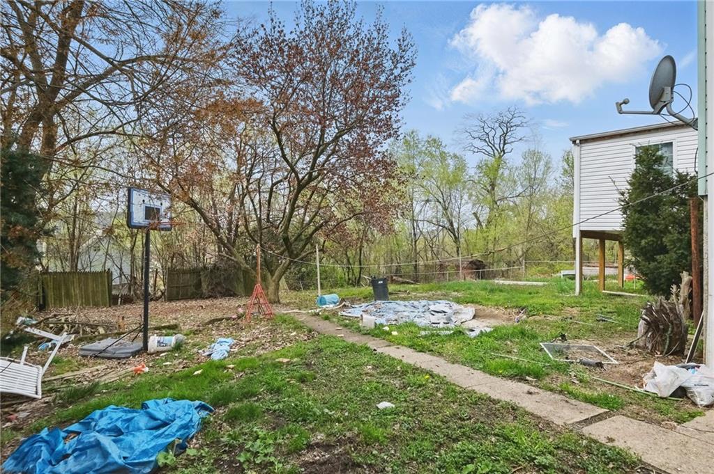 853 Railroad Street McKees Rocks, PA 15136 - Photo 16 of 19 a backyard of a house with lots of green space