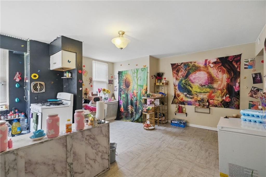 853 Railroad Street McKees Rocks, PA 15136 - Photo 4 of 19 a view of a room with gym equipment