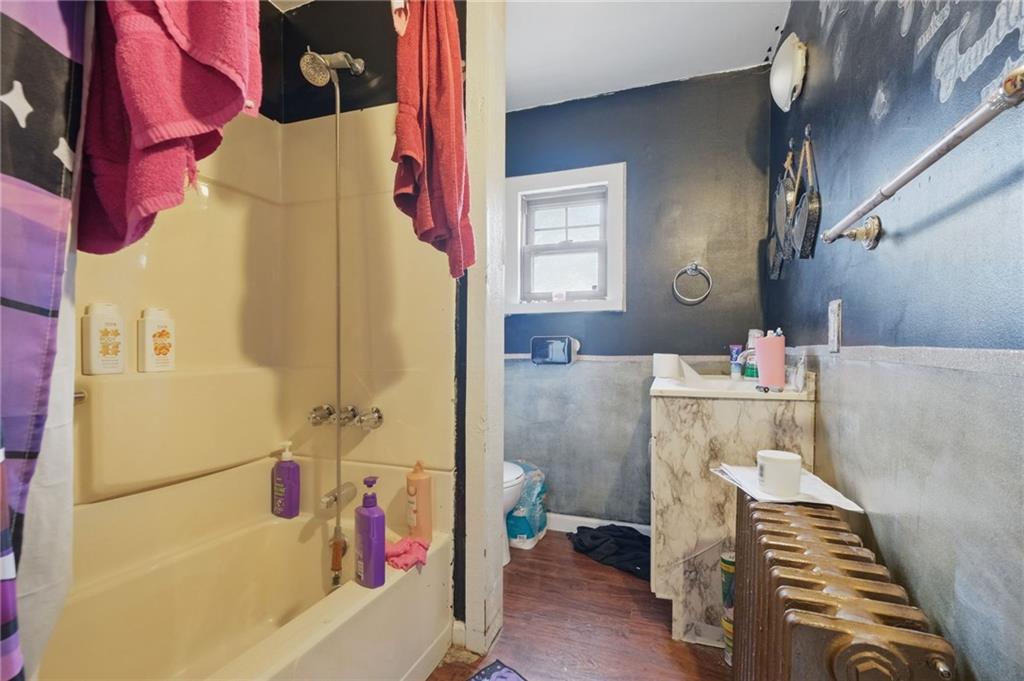 853 Railroad Street McKees Rocks, PA 15136 - Photo 8 of 19 a bathroom with a sink toilet and shower